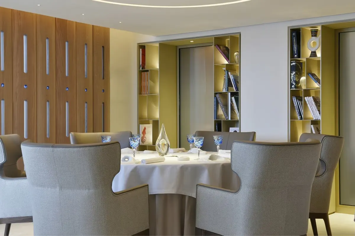 Intimate round table in warm-toned dining space
