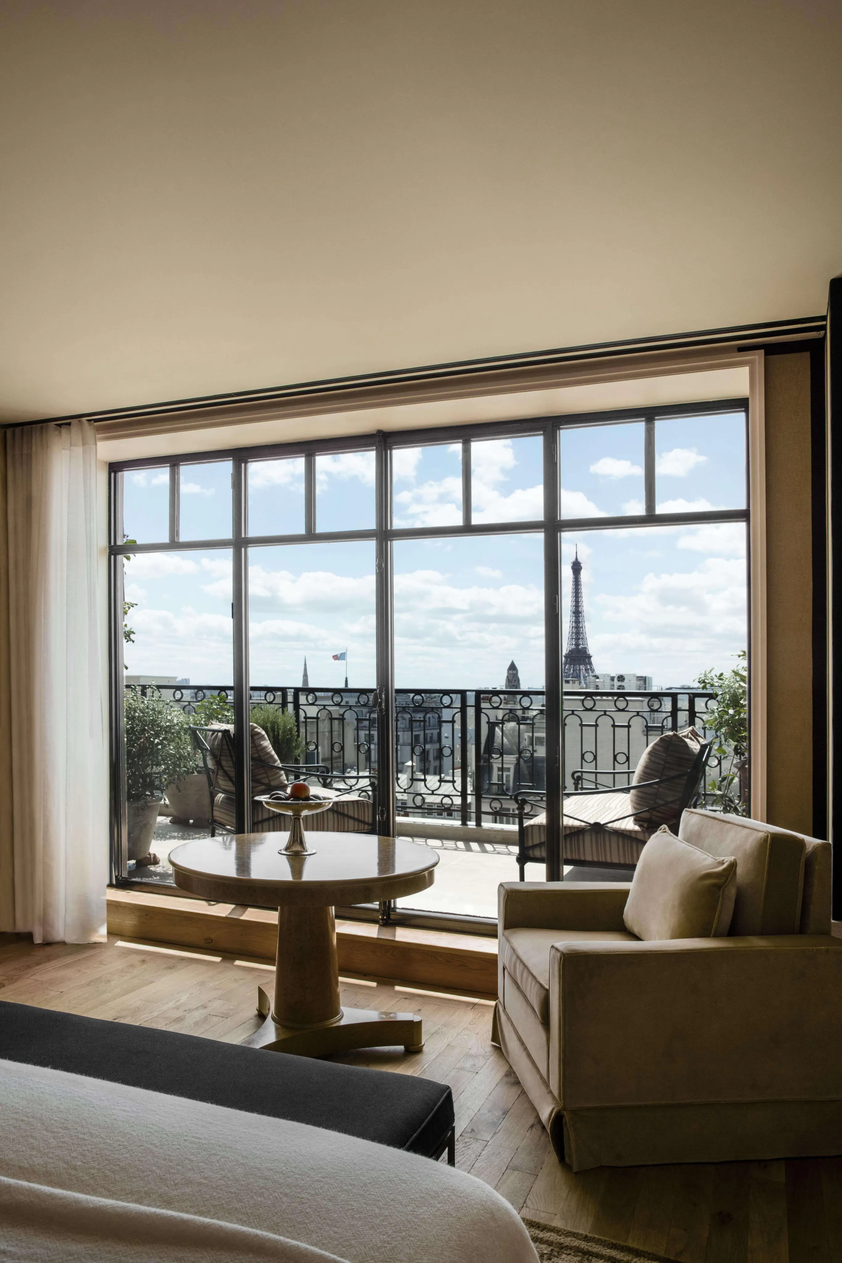 A Paris suite framing the Eiffel Tower through steel-framed windows