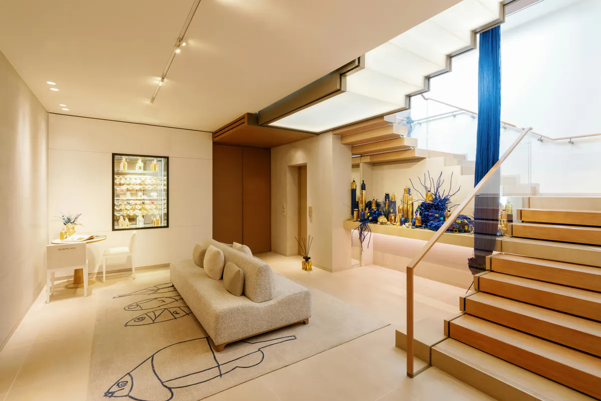 Modern spa entry with light wood and cream seating