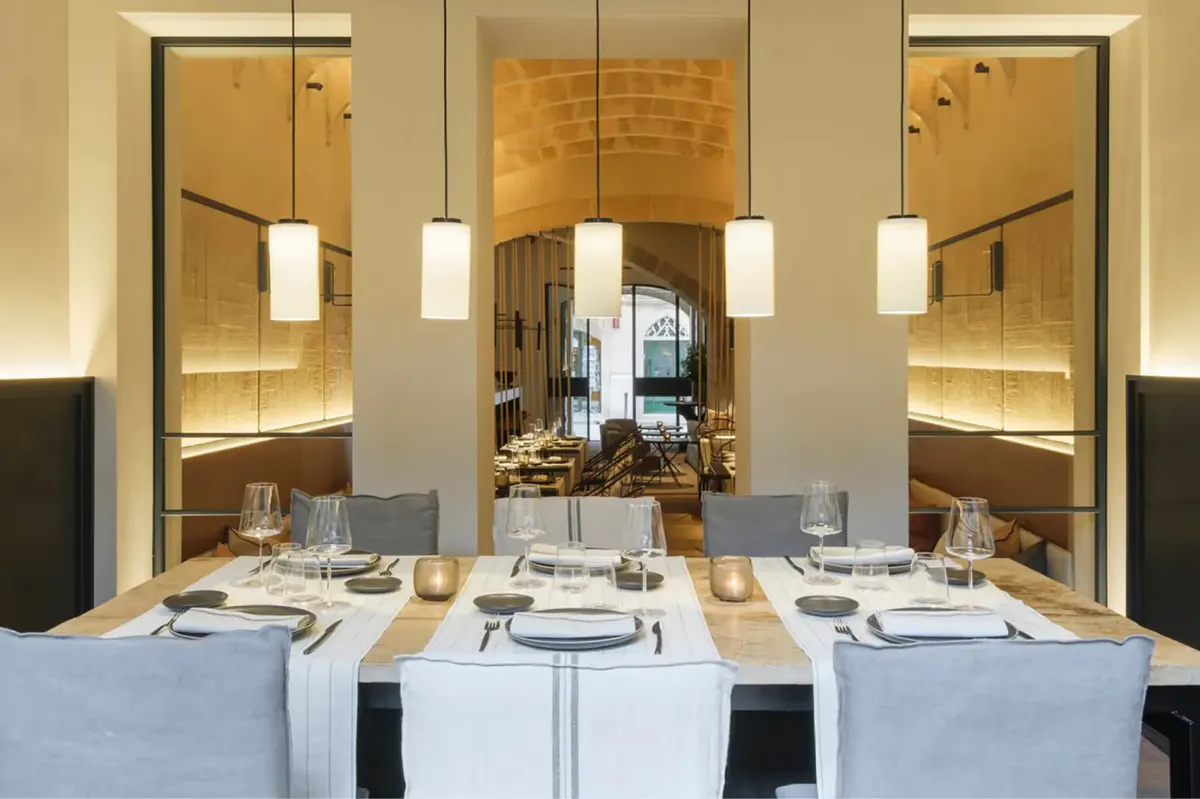 Fine dining room with arched windows and formally set table