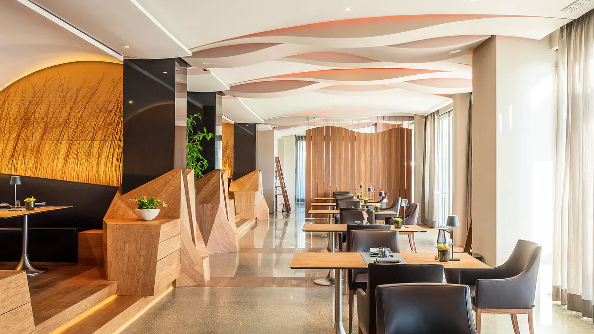 Modern restaurant with wood elements and arched doorways
