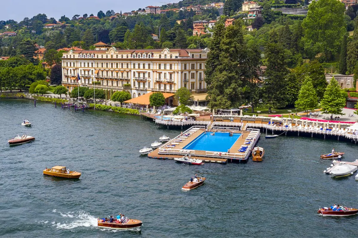 Waterfront view of the palazzo with surrounding lake and forested hillside