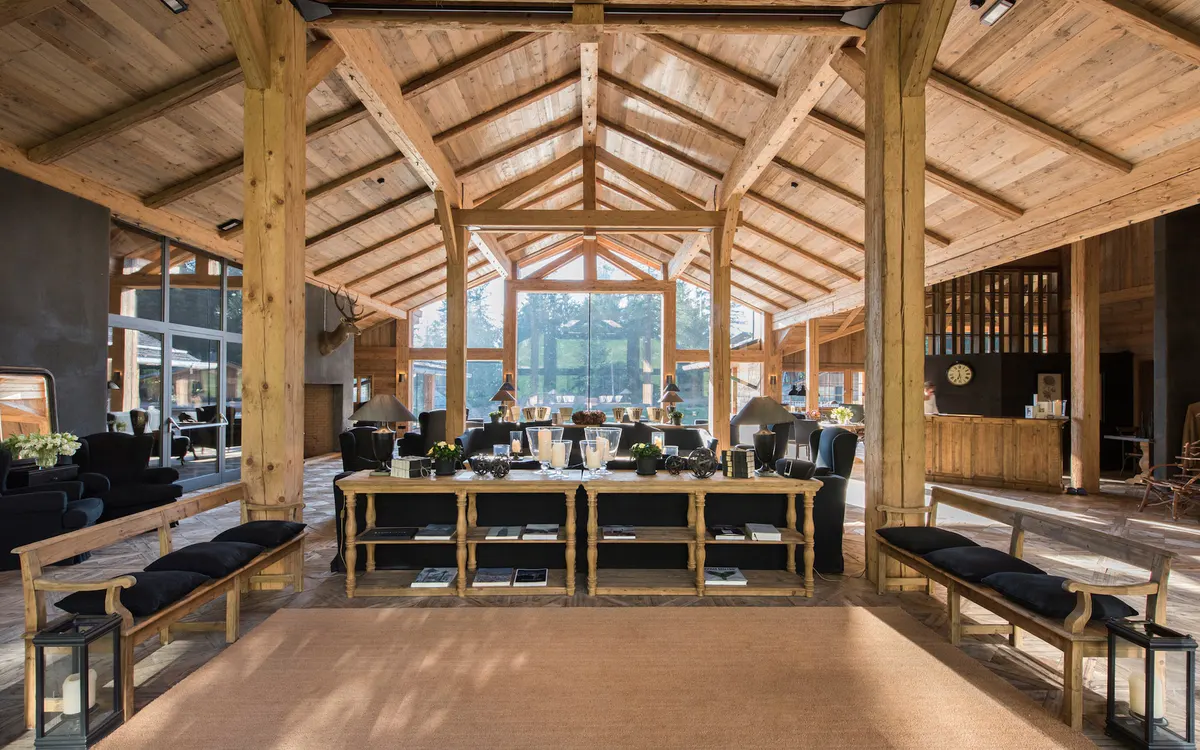 Open wooden pavilion with exposed beams and communal seating