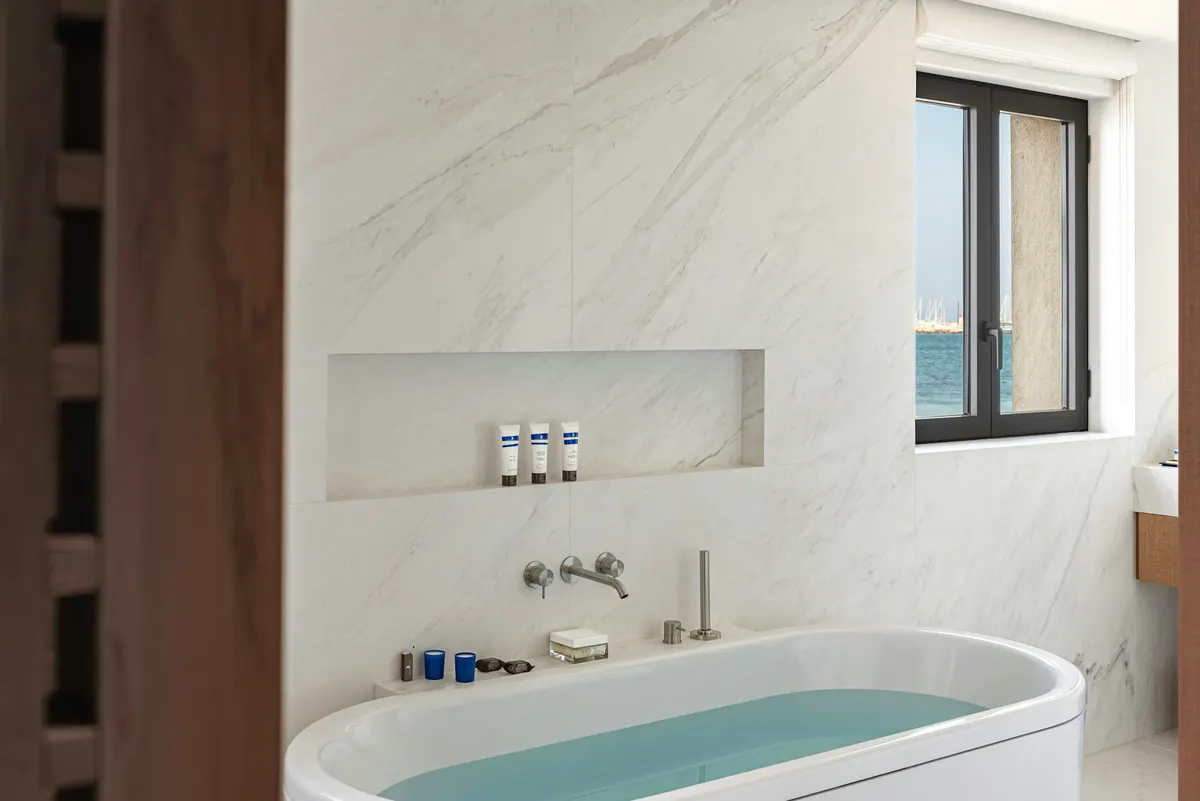 Contemporary bathroom with marble and sea-view window