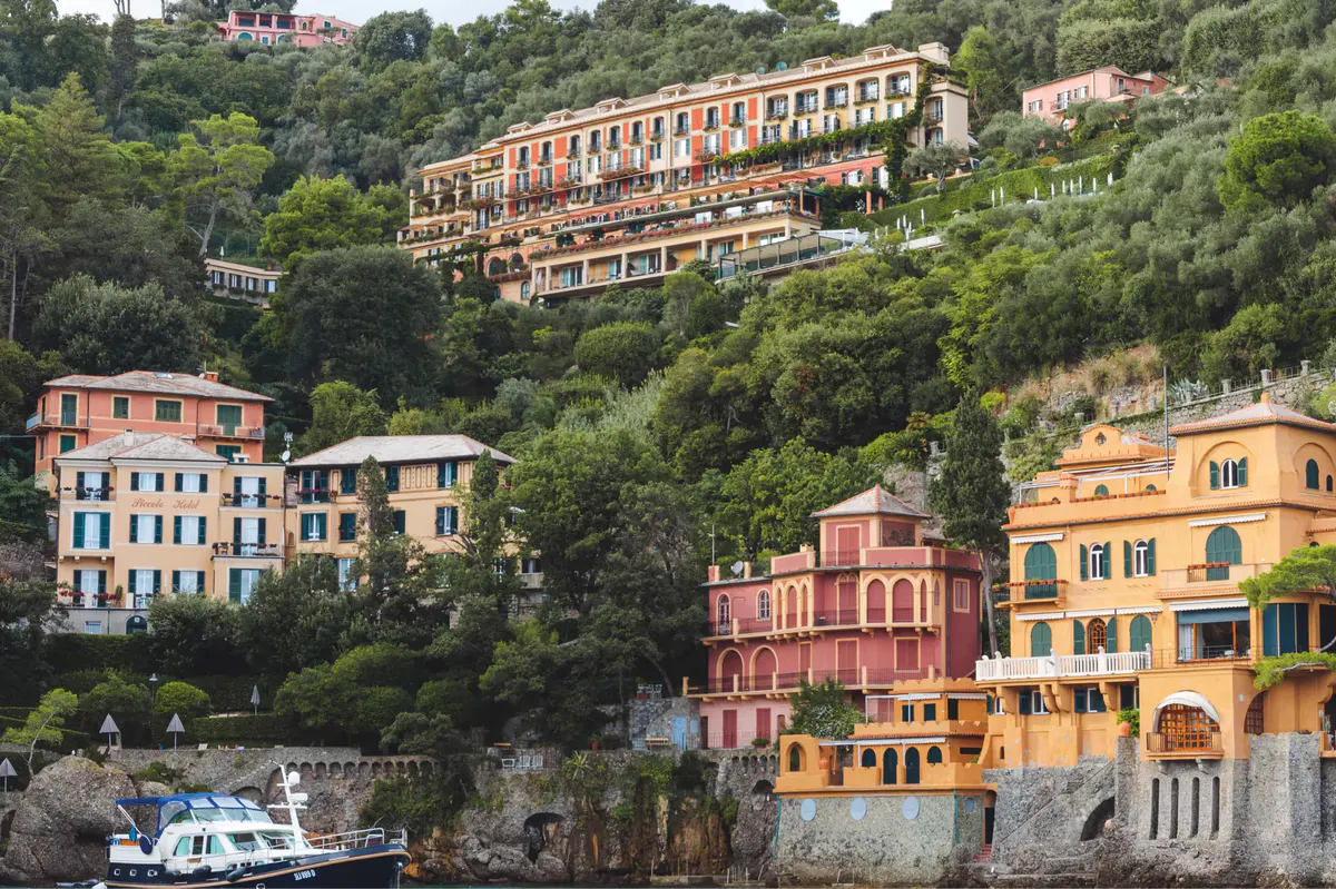 Pastel-colored buildings in the village of Portofino stacked on the hillside