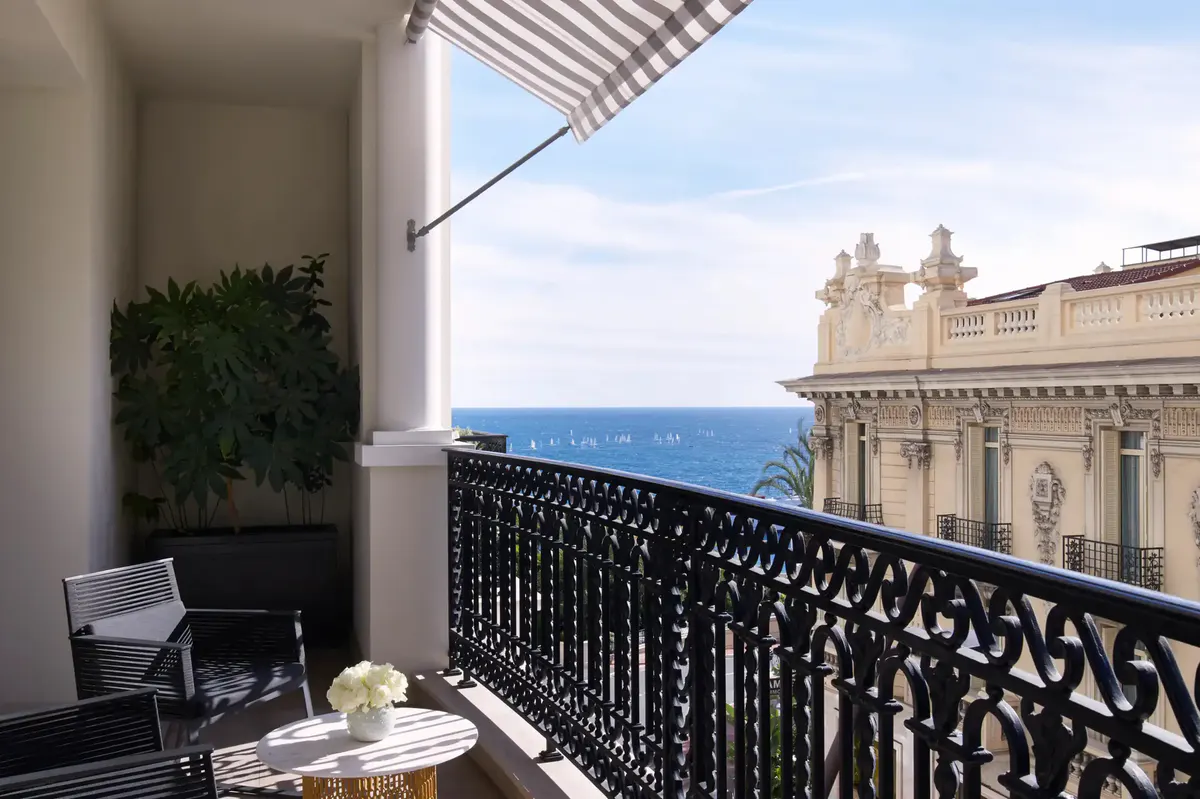 Private balcony with lounge chair overlooking palazzo and Mediterranean