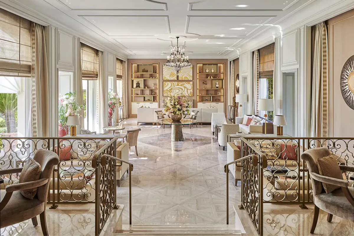 Elegant reception hall with classical fireplace and arched doorways