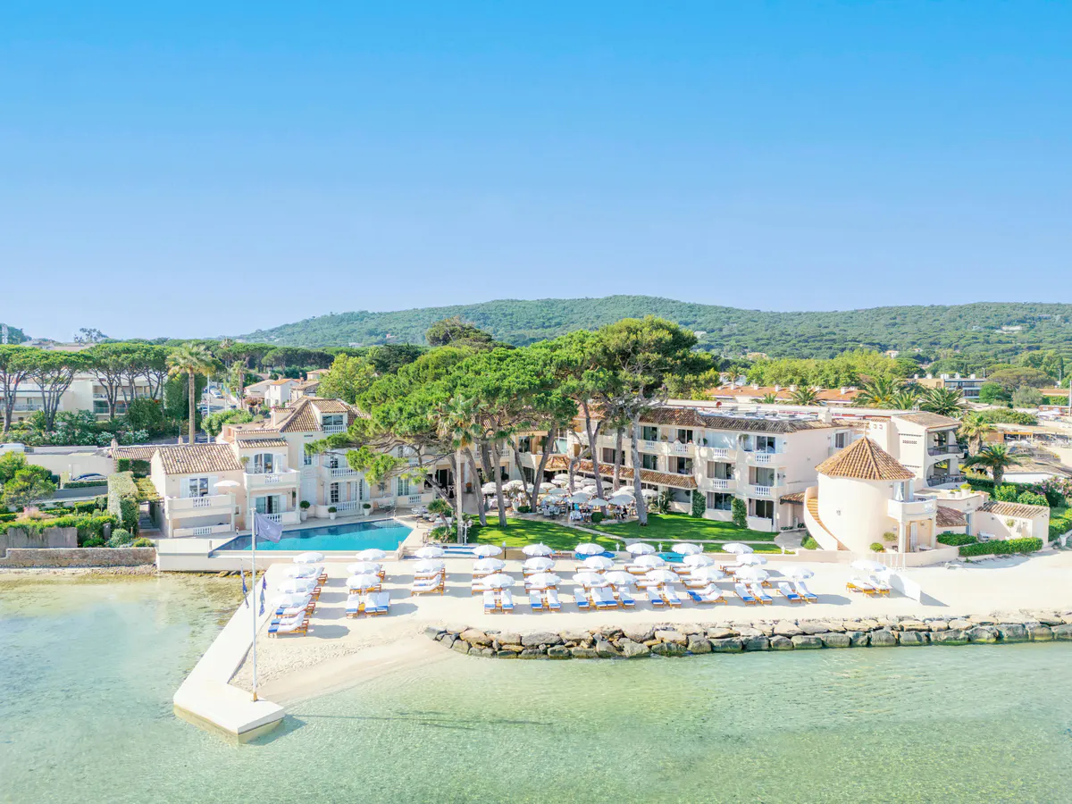 Aerial view of villa complex with pools overlooking Mediterranean