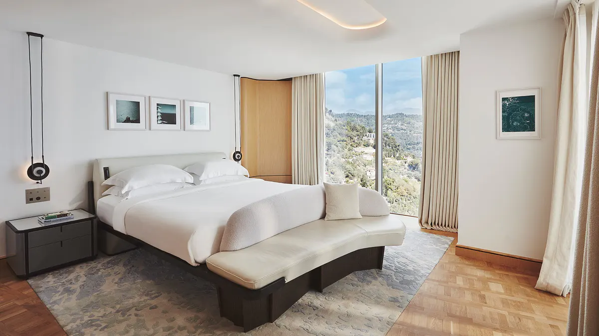 Bedroom with wood paneling and contemporary furnishings