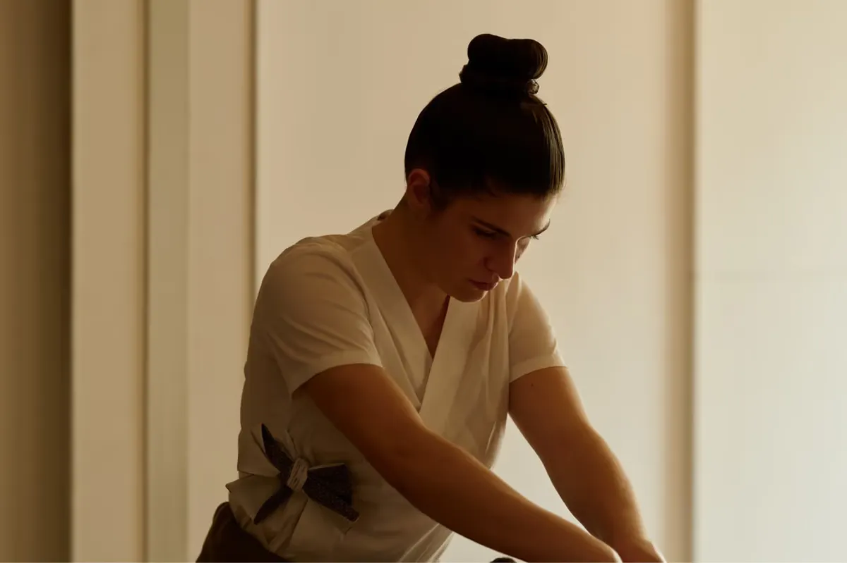 Massage or wellness treatment in progress in a light-filled room