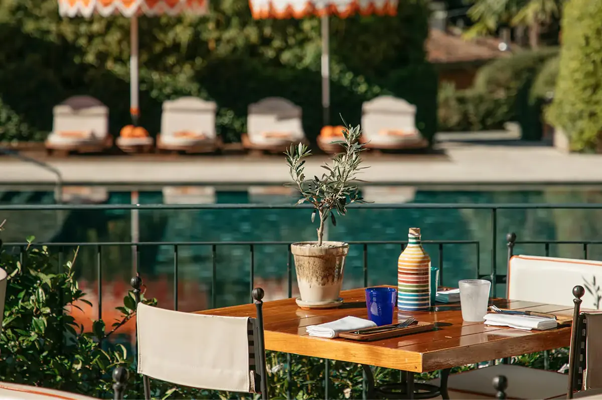 Poolside table with glasses and decorative centerpiece