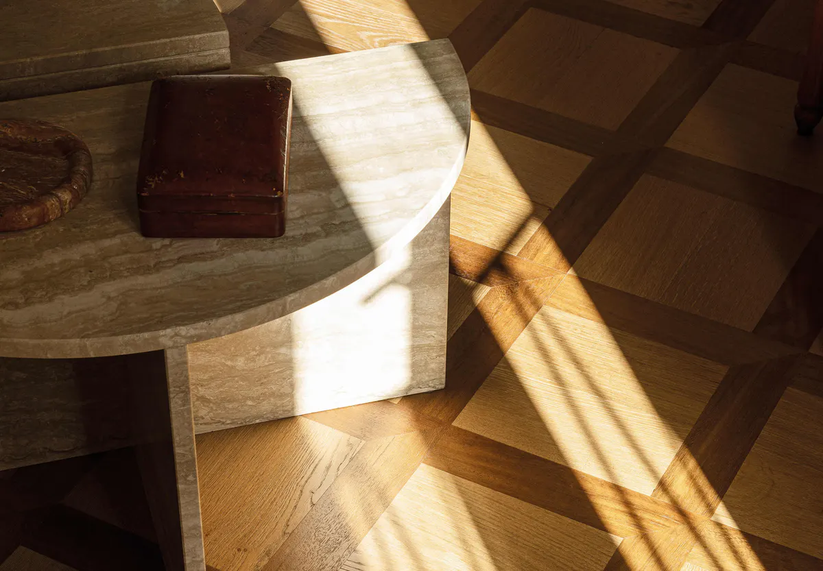 Wooden round table in room with natural light