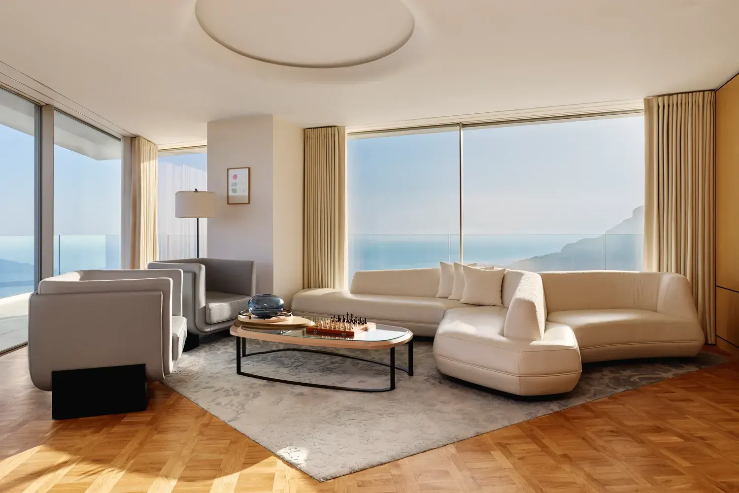A suite at the Maybourne Riviera with floor-to-ceiling glass over the sea