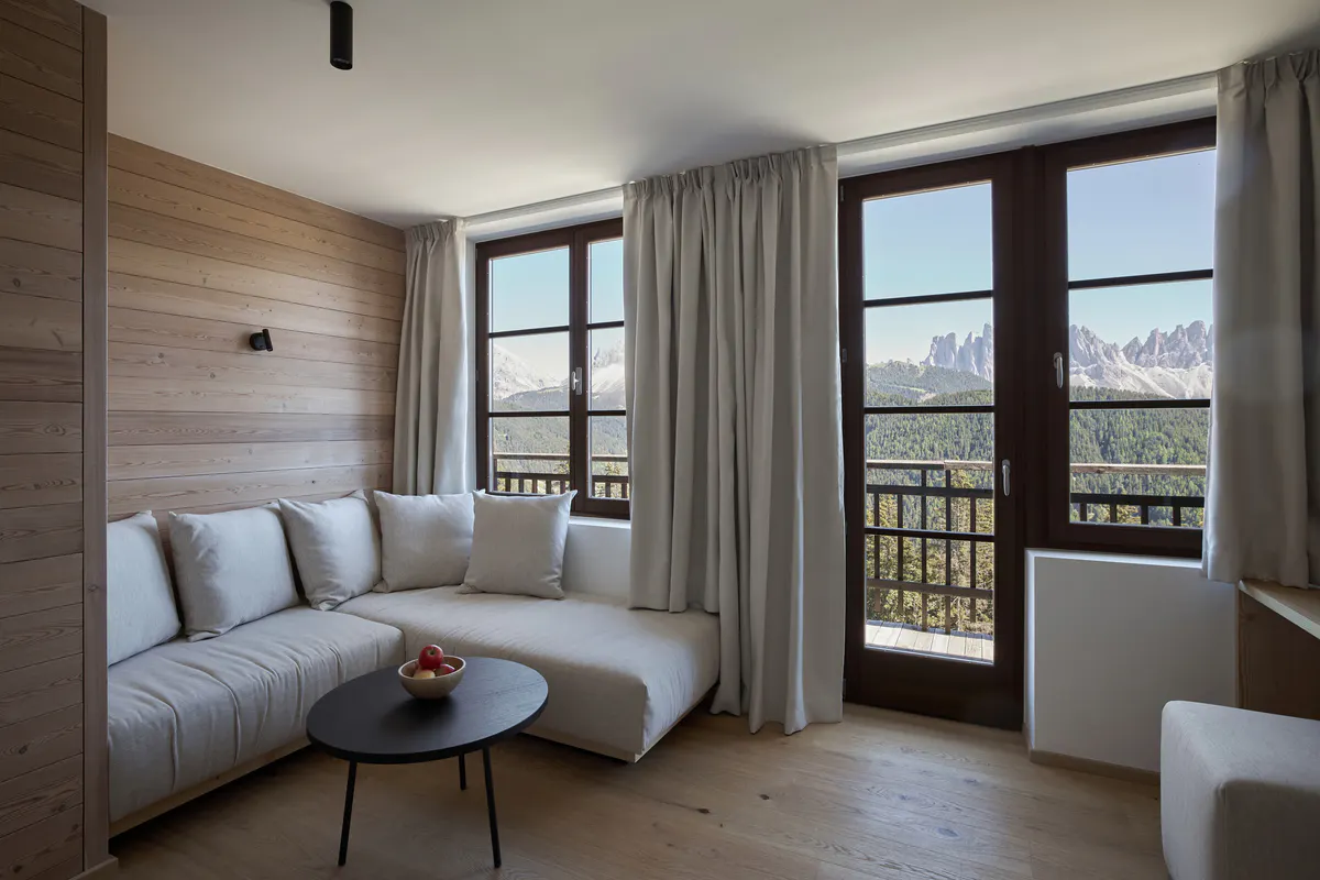 A spa changing area with light wood and concrete walls, minimal design, and soft natural light