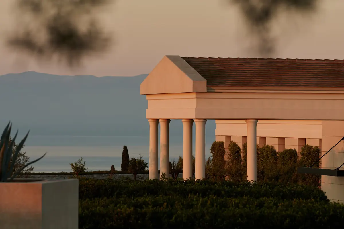 Waterfront terrace at dusk with fire feature and sea view