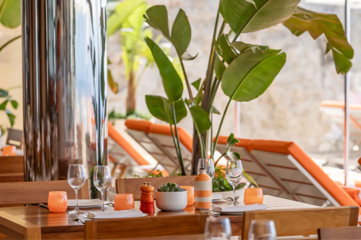 Intimate table setting with fresh flowers and sea view