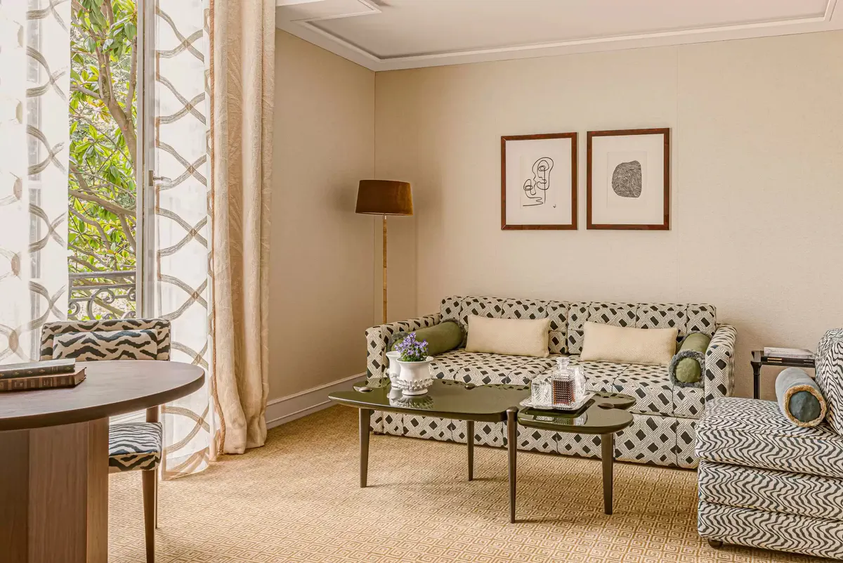 Double bedroom with metal frame bed, marble accents, and artwork above headboard