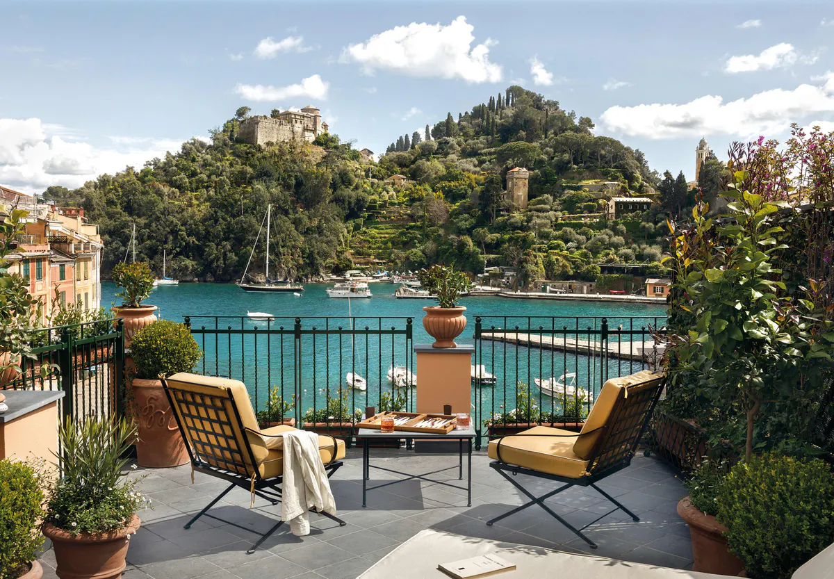 Terraced terrace overlooking harbor with lounge chairs