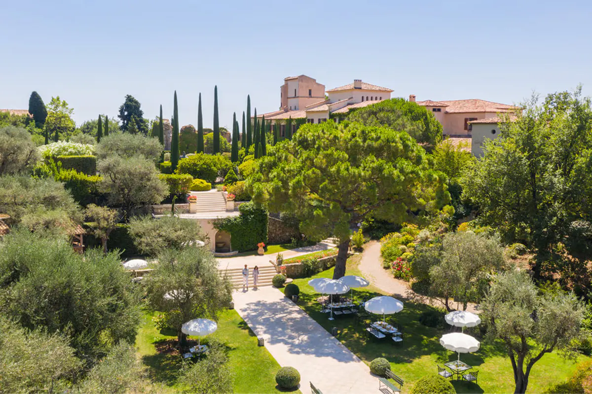 Estate grounds with château, olive groves, and heated infinity pool set in the landscape